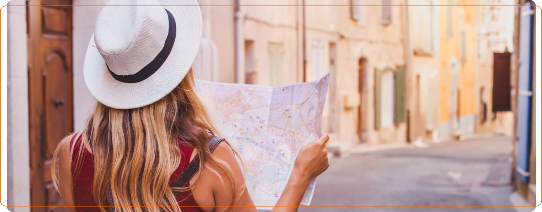 Person exploring a street with a map, representing travel and foreign currency needs.