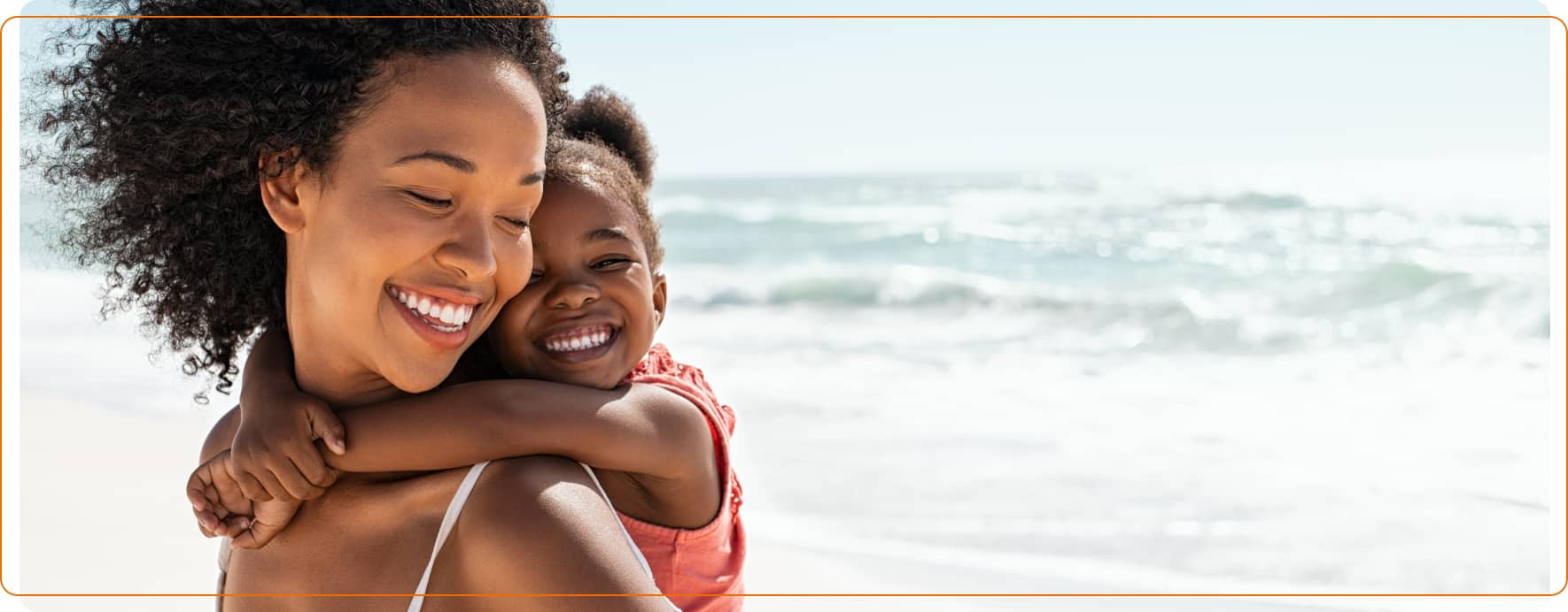 Parent and child enjoying a beach holiday, representing travel and foreign currency needs.