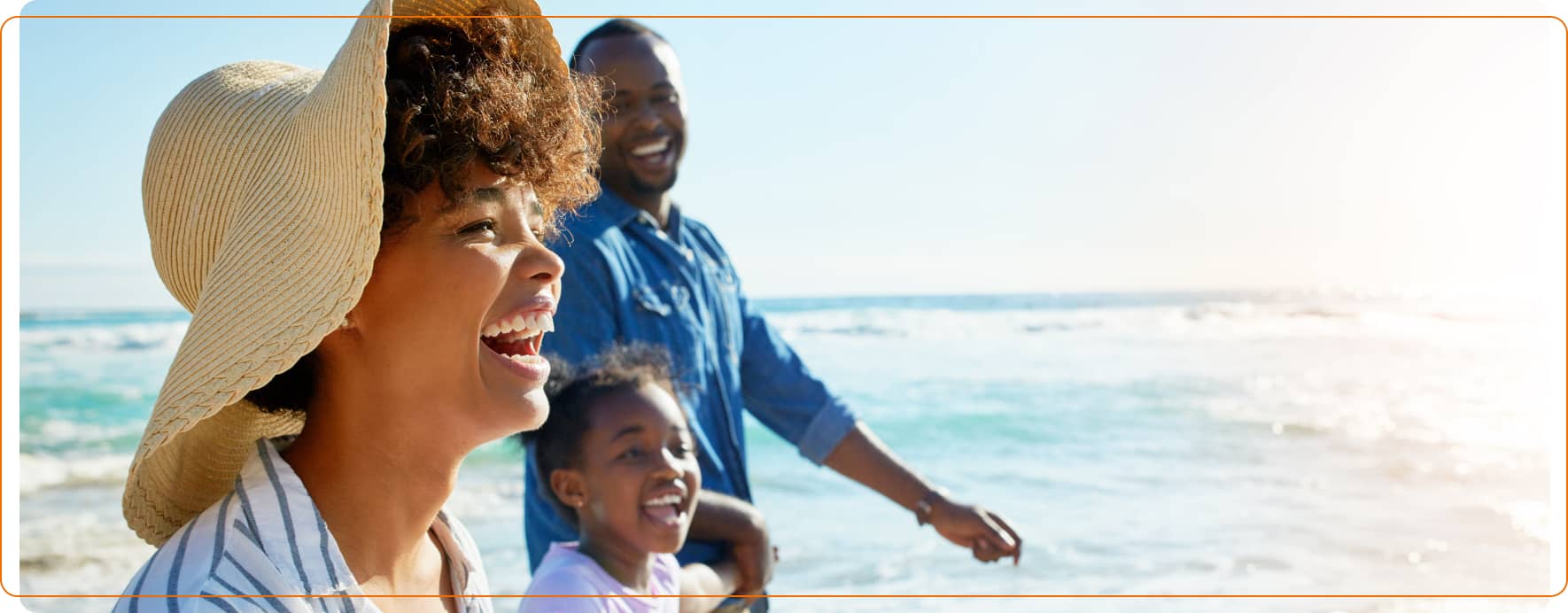 Family enjoying a beach holiday, representing Sainsbury’s Travel Money for stress-free travel.